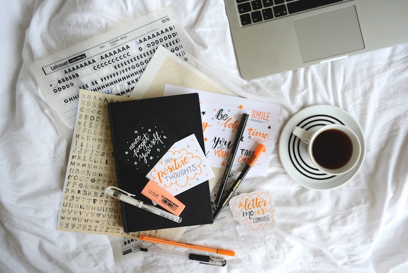 Planner stickers, markers, and a coffee mug